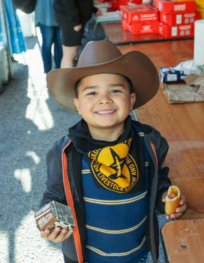 Smiling boy wearing a cowboy hat