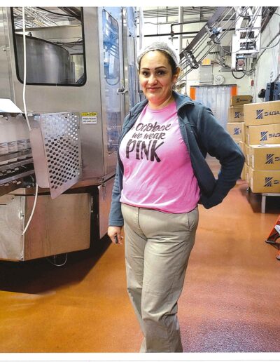 Woman wearing a t-shirt that says "In October We Wear Pink"