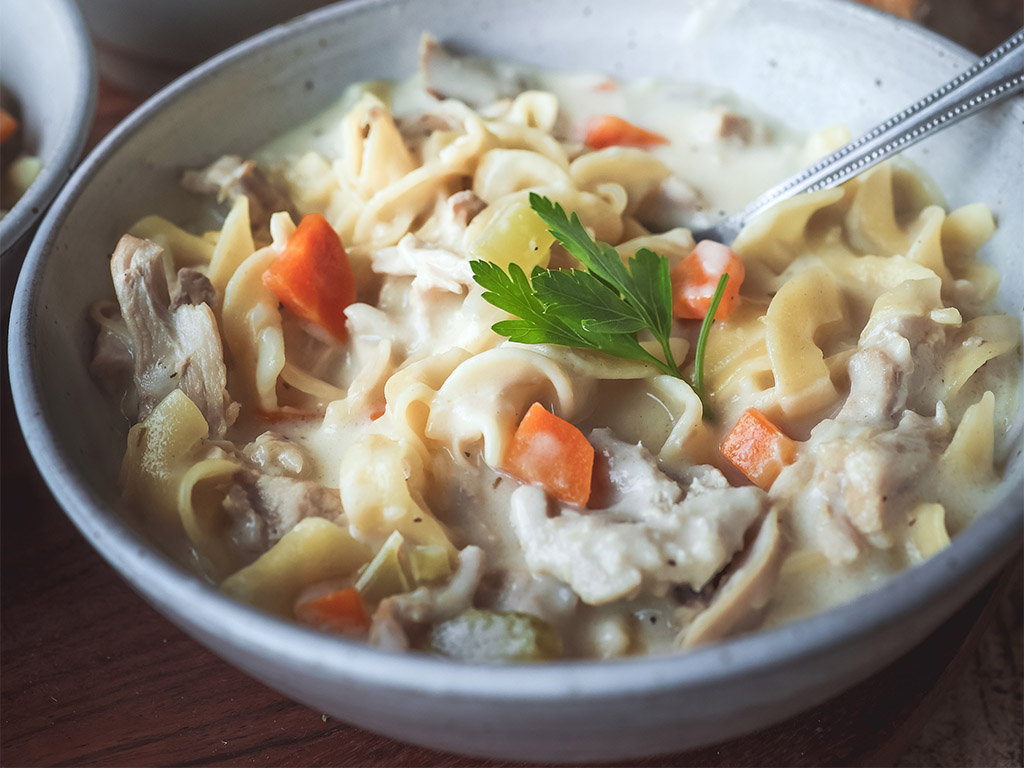 very close up of bowl of Creamy Chicken Noodle Soup