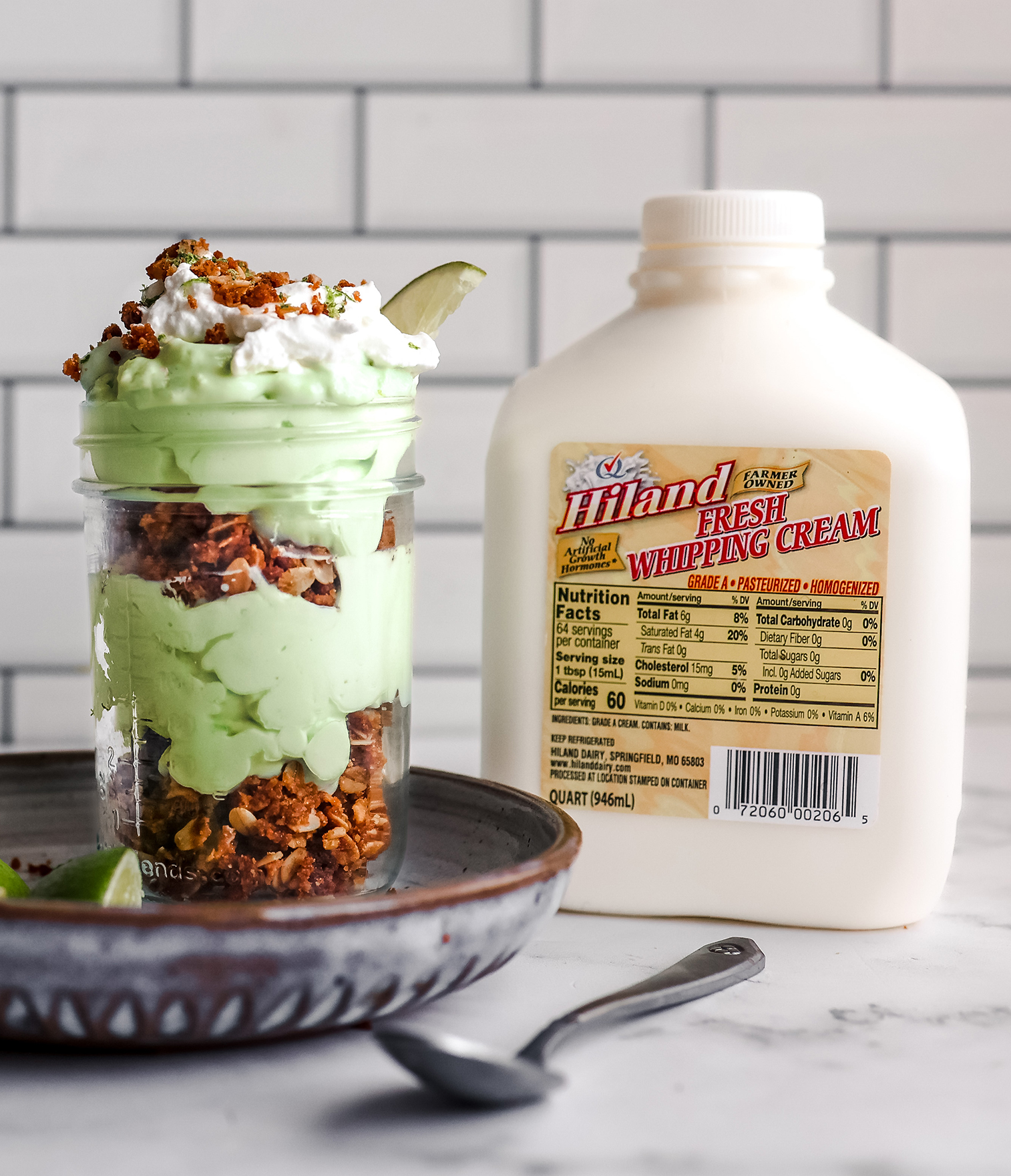 Key Lime Pie Mousse Parfait next to small jug of Hiland Heavy Cream