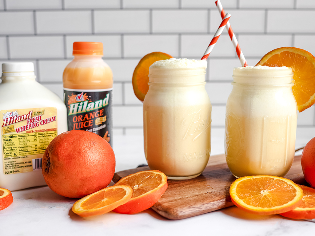 Two mason jars filled with Orange Creamsicle Slushies