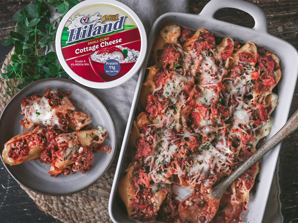 Hiland Cottage Cheese next to Italian Stuffed Shells on a plate