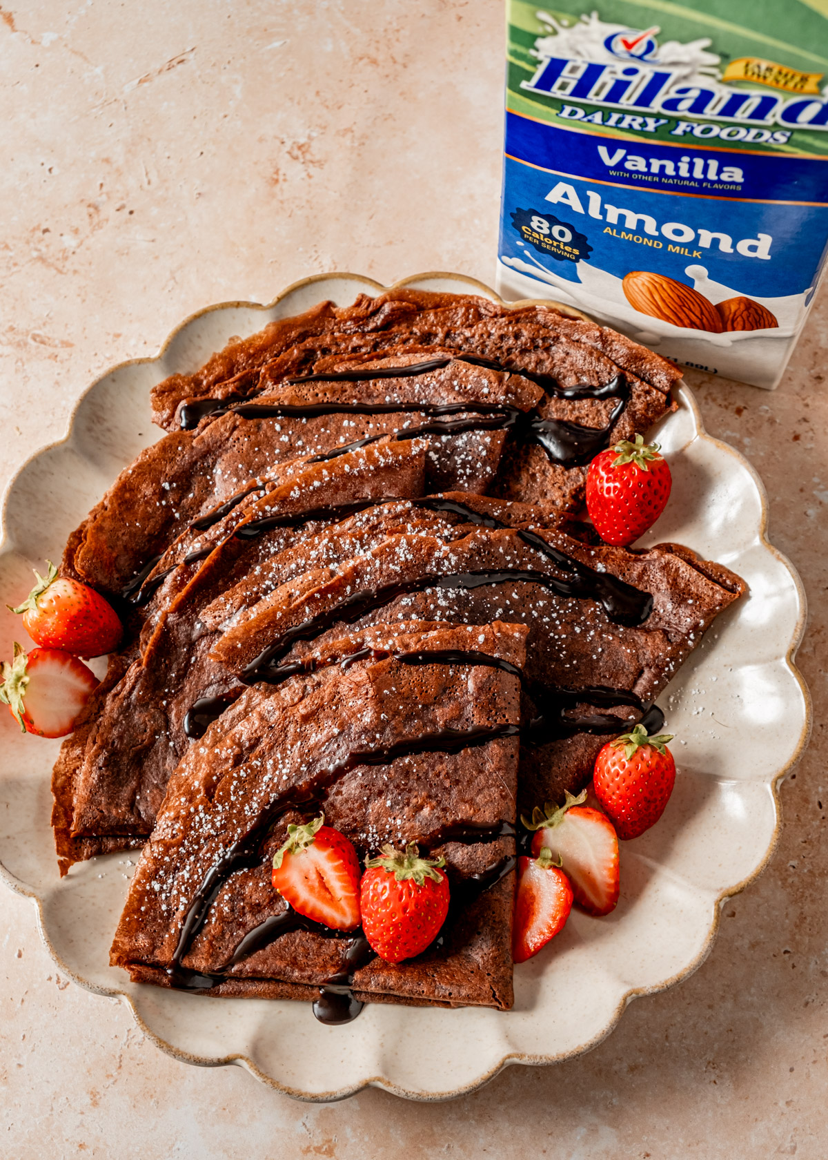 Chocolate Crepes next to a carton of Hiland Dairy Vanilla Almond Milk