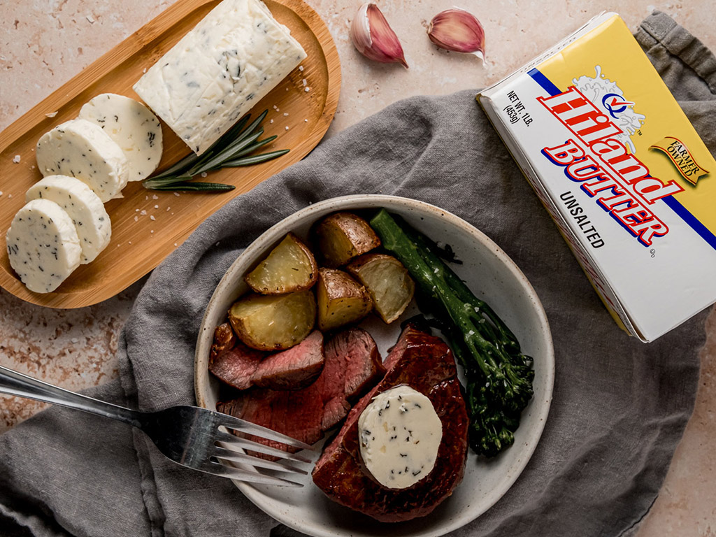 Bowl with potatoes garnished with Rosemary Garlic Butter