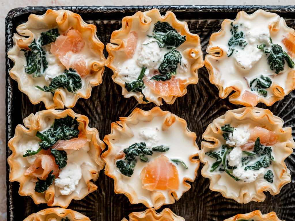 Salmon and Goat Cheese Tartlets on a decorative metal serving platter