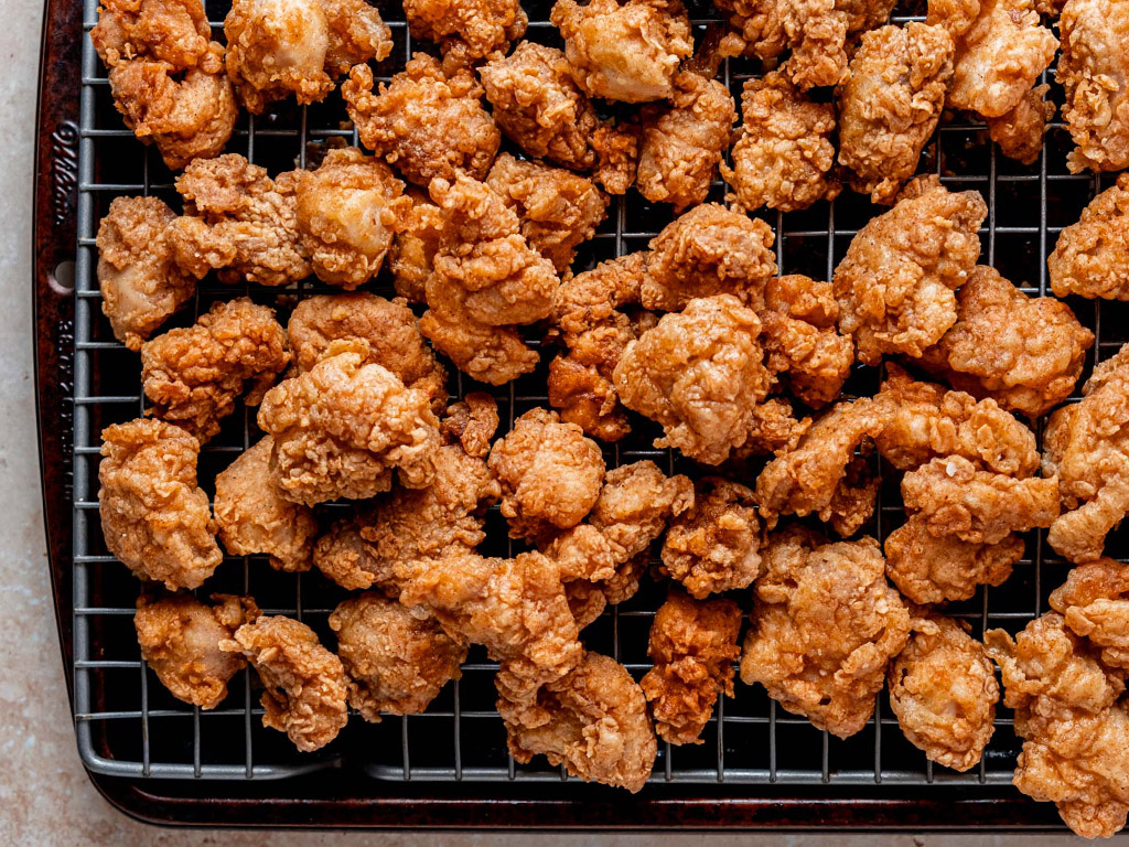 Sweet Tea Popcorn Chicken cooling on a wire rack